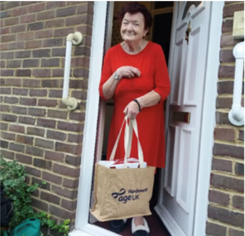 A resident receiving her care package. Picture: Age UK Wandsworth